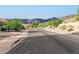 Quiet residential street with mountain views in the background at 4119 S Las Villa Way, Gold Canyon, AZ 85118