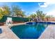 Inviting swimming pool with a water feature and basketball hoop at 4119 S Las Villa Way, Gold Canyon, AZ 85118