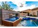 Water feature detail of a modern pool and spa at 4119 S Las Villa Way, Gold Canyon, AZ 85118