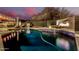Beautiful pool with a rock waterfall and surrounding lush landscape, perfect for relaxation and backyard entertainment at 4119 S Las Villa Way, Gold Canyon, AZ 85118
