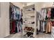 Walk-in closet complete with shelves, rods, and shoe storage for optimal organization at 4119 S Las Villa Way, Gold Canyon, AZ 85118