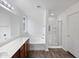 Clean bathroom with a soaking tub and a walk-in shower at 41876 W Corvalis Ln, Maricopa, AZ 85138