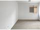 Bright bedroom with neutral carpeting and a window at 41876 W Corvalis Ln, Maricopa, AZ 85138