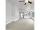 Spacious living room with high ceilings and neutral carpeting at 41876 W Corvalis Ln, Maricopa, AZ 85138