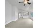 Spacious living room with high ceilings and neutral carpeting at 41876 W Corvalis Ln, Maricopa, AZ 85138