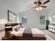 Large main bedroom with ceiling fan and ample natural light at 41876 W Corvalis Ln, Maricopa, AZ 85138