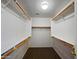Large walk-in closet with double rods and shelving at 41876 W Corvalis Ln, Maricopa, AZ 85138