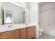 Bathroom with double vanity and tub shower combo at 4233 E Colonial Dr, Chandler, AZ 85249