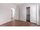 Bedroom with wood-look flooring and closet at 4233 E Colonial Dr, Chandler, AZ 85249