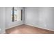Bright bedroom with wood-look flooring and window at 4233 E Colonial Dr, Chandler, AZ 85249