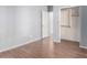 Bedroom with wood-look flooring and closet at 4233 E Colonial Dr, Chandler, AZ 85249