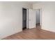 Bedroom with wood-look flooring and closet at 4233 E Colonial Dr, Chandler, AZ 85249