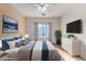 Relaxing bedroom with a comfortable bed and plenty of dresser storage at 4233 E Colonial Dr, Chandler, AZ 85249