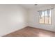 Bedroom with wood-look flooring and window at 4233 E Colonial Dr, Chandler, AZ 85249