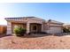 One-story home with tan exterior, tile roof, and attached garage at 4233 E Colonial Dr, Chandler, AZ 85249