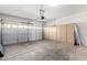 Garage with storage cabinets and opener at 4233 E Colonial Dr, Chandler, AZ 85249