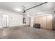Spacious garage with ample storage cabinets and workshop area at 4233 E Colonial Dr, Chandler, AZ 85249