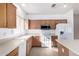 Bright kitchen with wood cabinets, island, and stainless steel appliances at 4233 E Colonial Dr, Chandler, AZ 85249