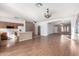Kitchen features wood cabinets, laminate floors, and an island at 4233 E Colonial Dr, Chandler, AZ 85249