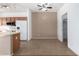 Kitchen with wood cabinets, tile floors, and a breakfast bar at 4233 E Colonial Dr, Chandler, AZ 85249