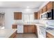 Kitchen features wood cabinets, ample counter space, and a view to backyard at 4233 E Colonial Dr, Chandler, AZ 85249