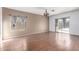 Bright living room with laminate floors and sliding glass doors at 4233 E Colonial Dr, Chandler, AZ 85249