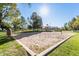 Sand volleyball court with surrounding green space at 4233 E Colonial Dr, Chandler, AZ 85249