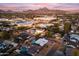 Aerial view of a house and neighborhood at sunset, showcasing the property's location and surrounding area at 6237 N 5Th Pl, Phoenix, AZ 85012