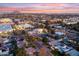 Aerial view of a residential neighborhood with a focus on a large house, at dusk at 6237 N 5Th Pl, Phoenix, AZ 85012