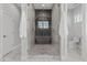 Modern bathroom with a large walk-in shower and marble tile at 6237 N 5Th Pl, Phoenix, AZ 85012