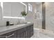 Modern bathroom with marble finishes and a walk-in shower at 6237 N 5Th Pl, Phoenix, AZ 85012