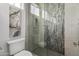 Bathroom with a toilet and a glass-enclosed shower with unique tile at 6237 N 5Th Pl, Phoenix, AZ 85012