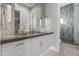 Modern bathroom with white cabinets, a dark countertop, and a walk-in shower at 6237 N 5Th Pl, Phoenix, AZ 85012