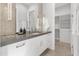 Modern bathroom with a floating vanity, large mirror, and a walk-in closet at 6237 N 5Th Pl, Phoenix, AZ 85012