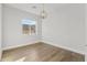 Light and airy bedroom with wood flooring and a large window at 6237 N 5Th Pl, Phoenix, AZ 85012