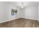 Bright bedroom with wood flooring and a window overlooking the backyard at 6237 N 5Th Pl, Phoenix, AZ 85012