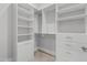 Large walk-in closet with built-in shelves and drawers at 6237 N 5Th Pl, Phoenix, AZ 85012
