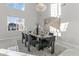 Bright dining room with large windows, chandelier, and modern decor at 6237 N 5Th Pl, Phoenix, AZ 85012