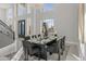 Formal dining room with a large table, modern chairs, and a stunning chandelier at 6237 N 5Th Pl, Phoenix, AZ 85012