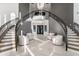 Stunning entryway with double curved staircase and chandelier at 6237 N 5Th Pl, Phoenix, AZ 85012