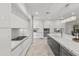 Modern white kitchen with stainless steel appliances and marble countertops at 6237 N 5Th Pl, Phoenix, AZ 85012