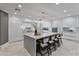 Modern kitchen with white cabinetry, a large island, and marble countertops at 6237 N 5Th Pl, Phoenix, AZ 85012