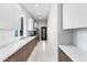 Modern kitchen with wood cabinets, white countertops, and stainless steel appliances at 6237 N 5Th Pl, Phoenix, AZ 85012