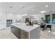 Modern kitchen with large island, marble countertops, and stainless steel appliances at 6237 N 5Th Pl, Phoenix, AZ 85012