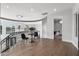Elegant upper floor landing with hardwood floors, a small sitting area, and a view of the lower floor at 6237 N 5Th Pl, Phoenix, AZ 85012