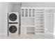 Laundry room with washer, dryer, built-in shelving, and a work surface at 6237 N 5Th Pl, Phoenix, AZ 85012