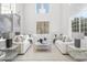 Spacious living room with high ceilings, large windows, and elegant furnishings at 6237 N 5Th Pl, Phoenix, AZ 85012