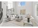 Bright living room featuring high ceilings, a marble floor, and comfortable seating at 6237 N 5Th Pl, Phoenix, AZ 85012
