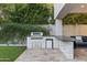 Outdoor kitchen with built-in grill and mini-fridge at 6237 N 5Th Pl, Phoenix, AZ 85012