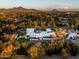 Aerial view of a luxurious home with a pool and mountain views at 6617 N Central Ave, Phoenix, AZ 85012